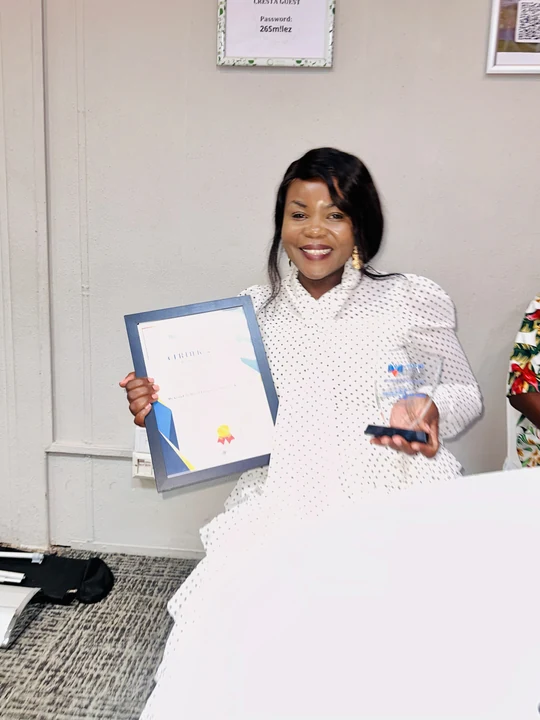 Yvonne Sibanda with the academy’s certificate and trophy.